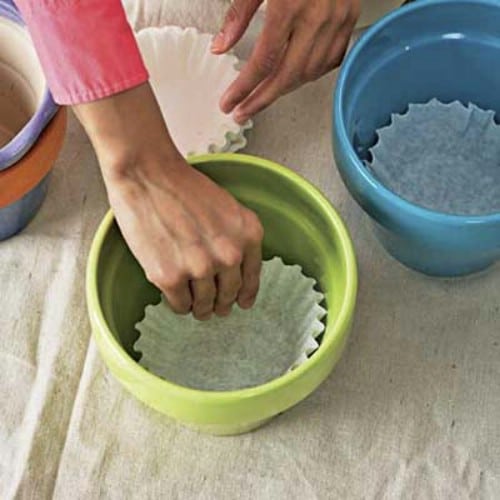 Stop leaking planters from getting dirt everywhere with coffee filters.