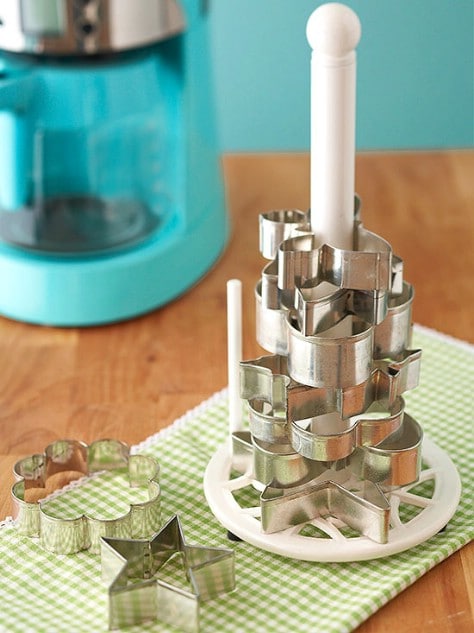 Organize cookie cutters with a paper towel rack.