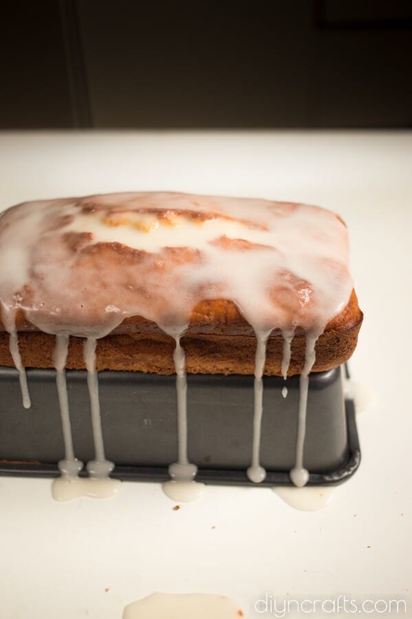 Spooning glaze over bread