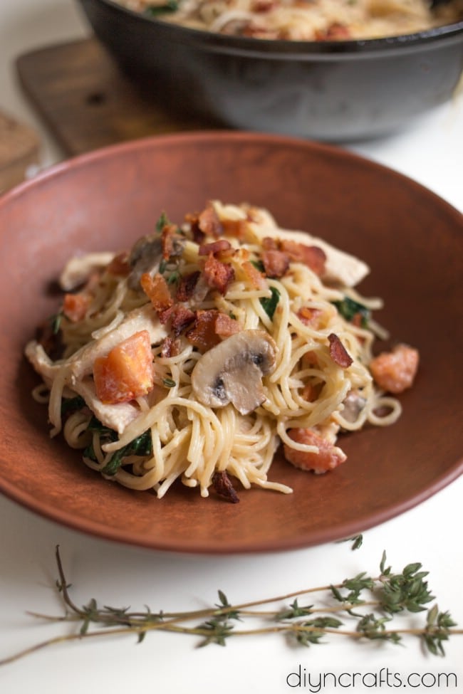 One serving of chicken, bacon, and spinach spaghetti.