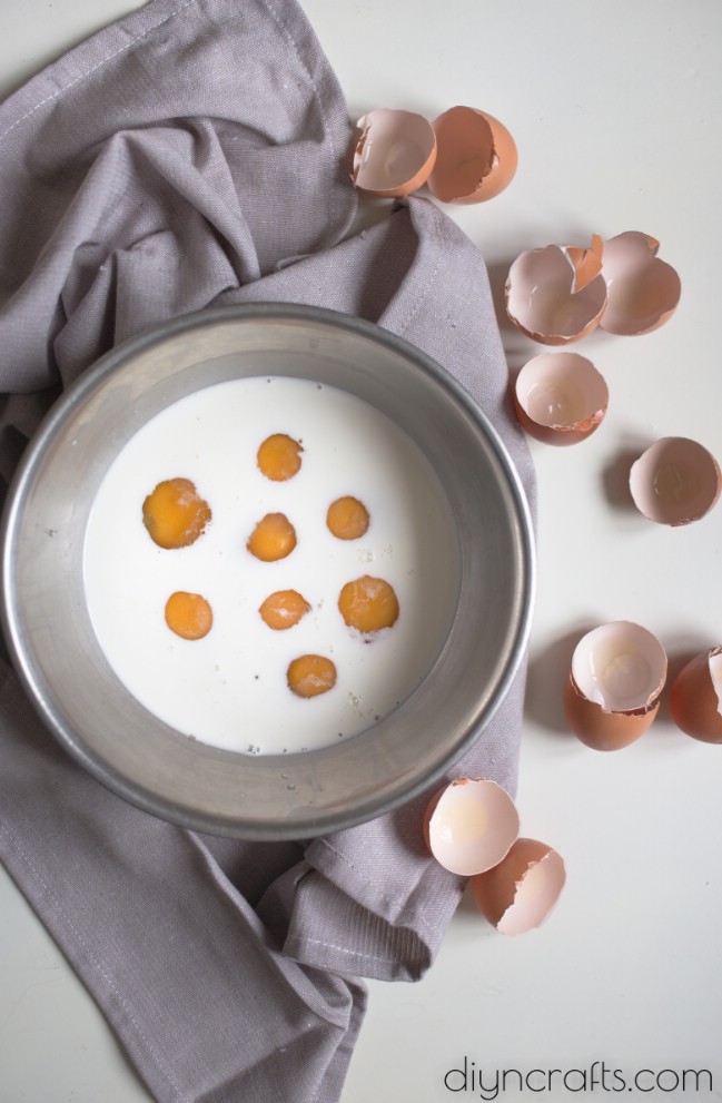 Mixing eggs with milk.