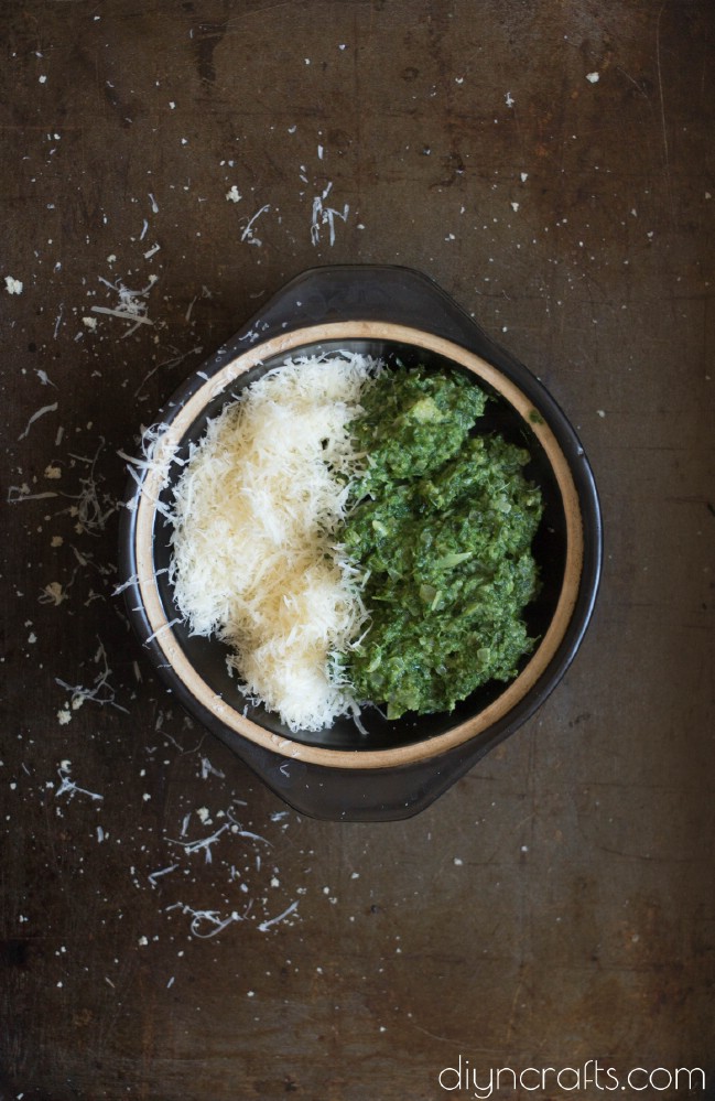 Mixing spinach and parmesan cheese.