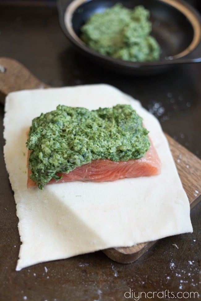 Coating salmon fillets.