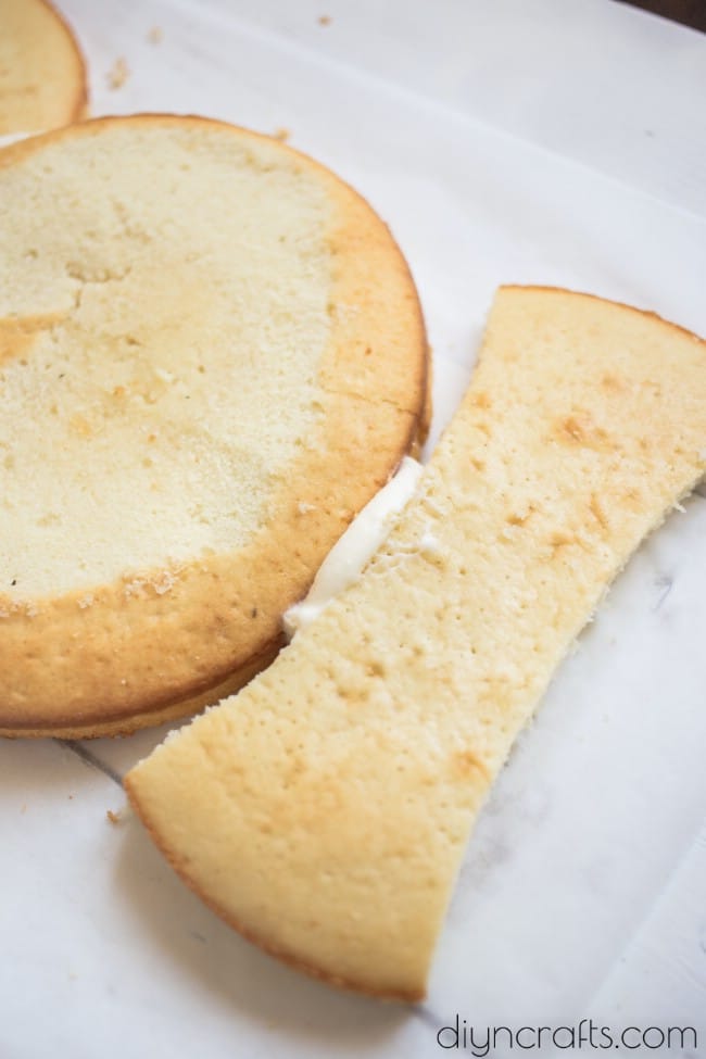Adding the bow tie under the cake.
