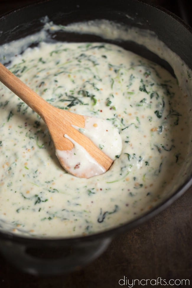 Cooking and mixing spinach with other ingredients.