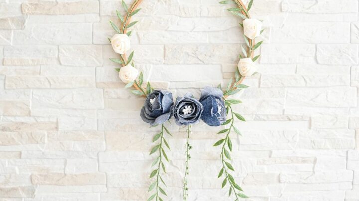 Denim Blooms Door Wreath 5 A close-up shot of a finished denim floral wreath, highlighting the texture of the denim roses and the delicate greenery.
