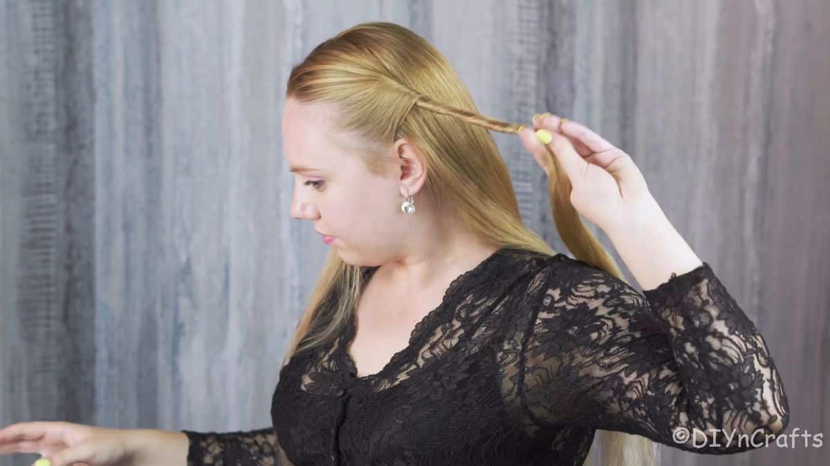 Artfully Twisted Low Braided Ponytail 7 Twisted sections tied together at the back