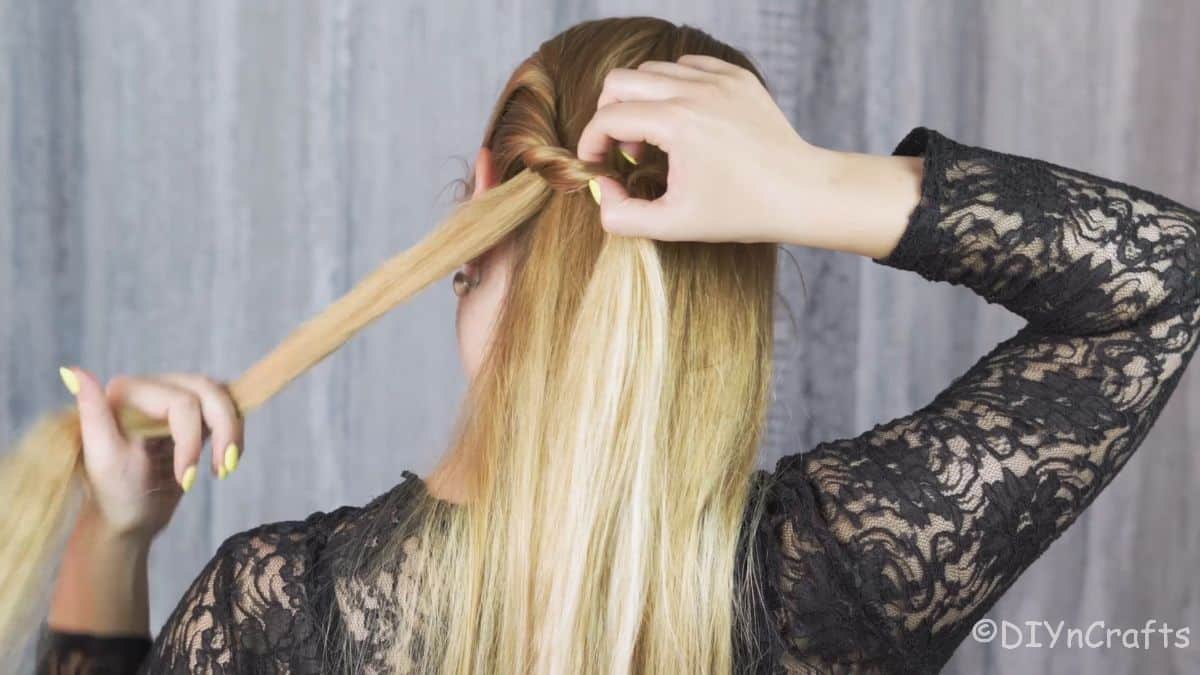 Artfully Twisted Low Braided Ponytail 10 All side sections neatly tucked and secured for the braid