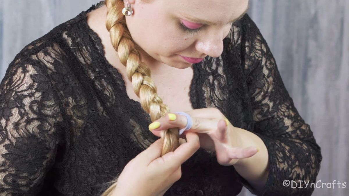 Artfully Twisted Low Braided Ponytail 12 Finishing the three-strand braid down to the ends