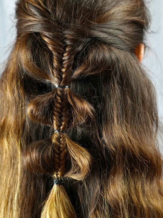 Fancy Palm Tree Bubble Braids Half-Updo 12 The accessorized Palm Tree Bubble Braids with added ribbons and decorative elements.